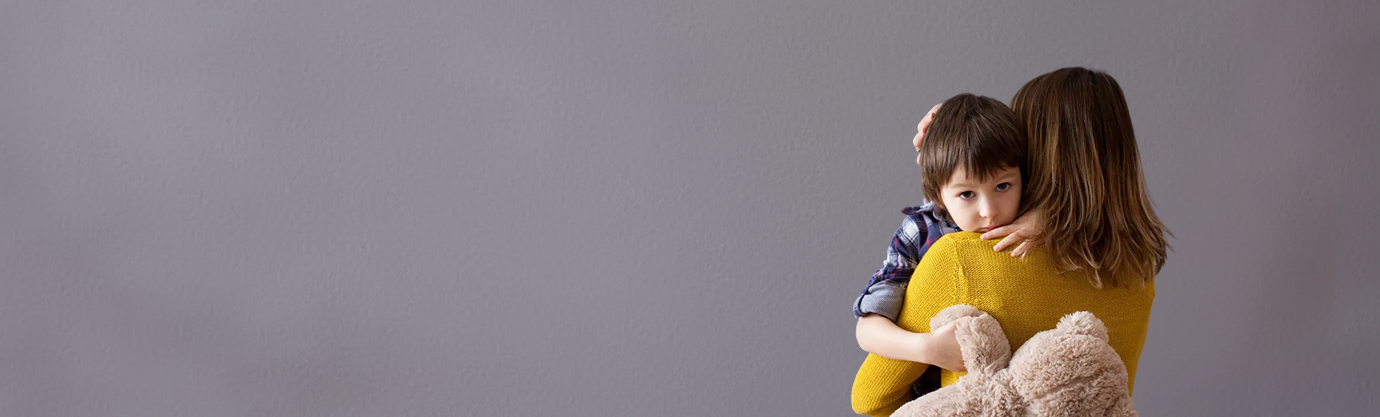 Child in caregiver’s arms